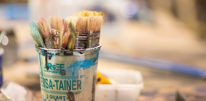 Paint brushes. Paint brushes in a paint can