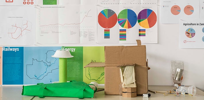 Diagrams and Design Product design student's desk with materials and prototypes