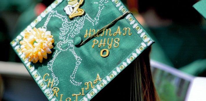 Decorated graduation cap that says human phys
