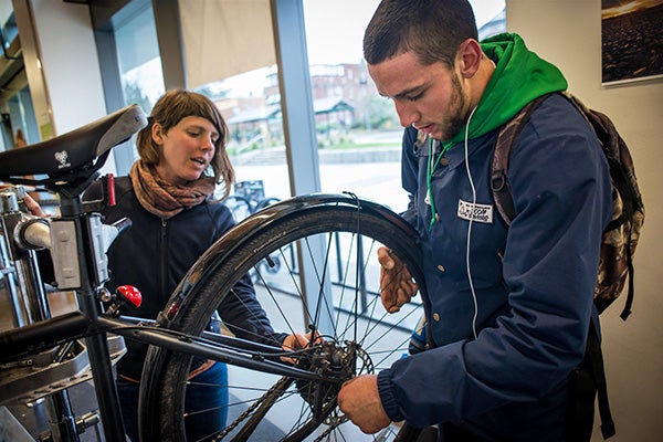 Students fixing a bike