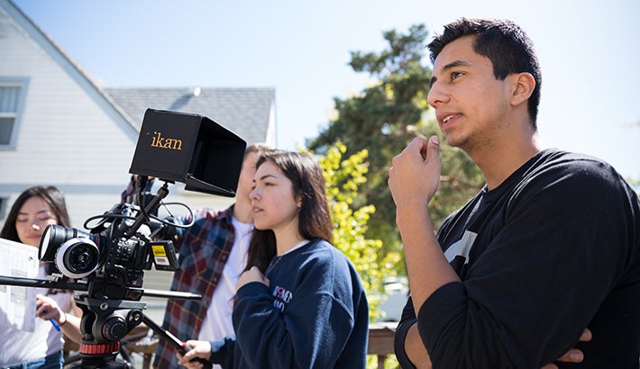 Cinema studies students using camera equipment