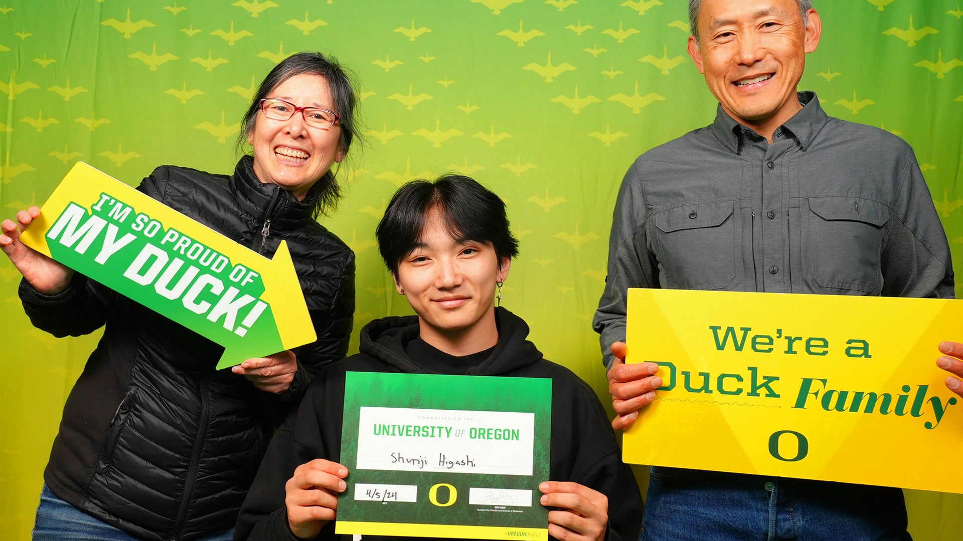 Student with parents celebrating student enrollment