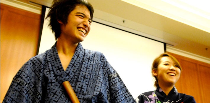 A man and woman wearing kimonos in Japanese class.
