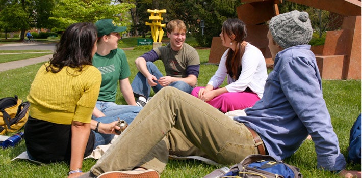 Group of students enjoying the sun outside. 