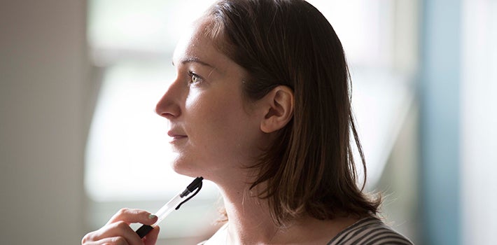 Female student thinking contemplatively 